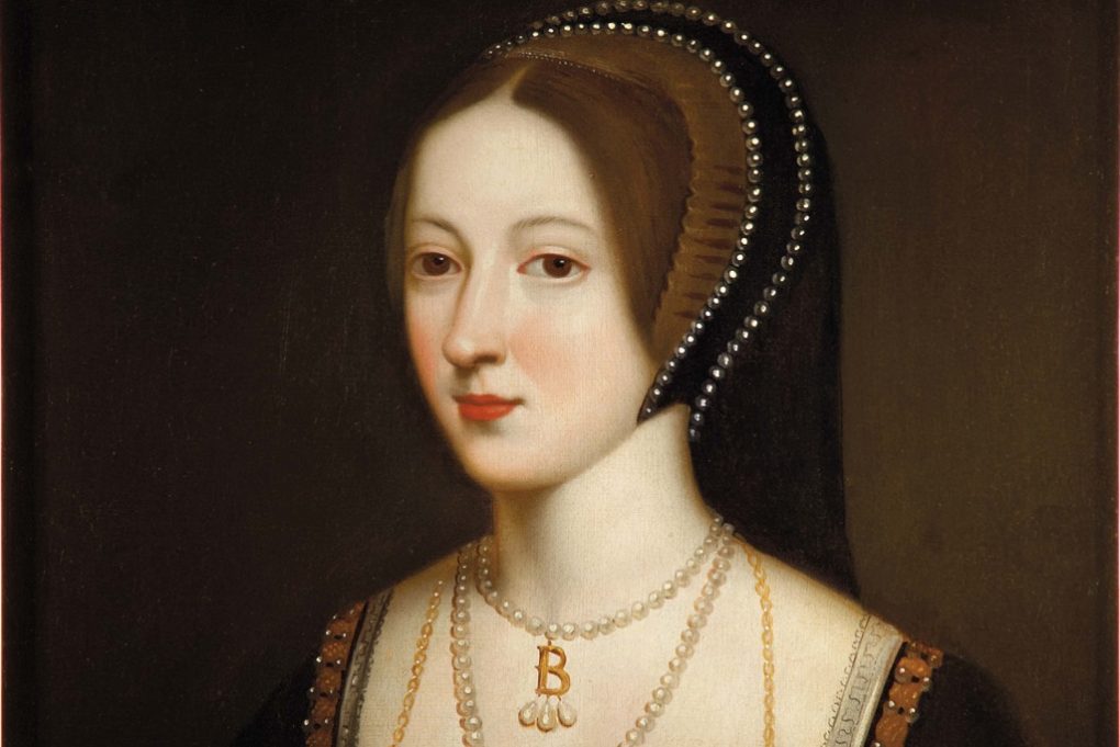 A portrait of Anne Boleyn wearing a pearly French hood and her signature 'B' necklace.