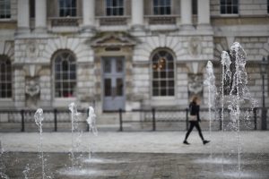 An image of Somerset House, with the background blurred and water from the fountains in focus in the forefront