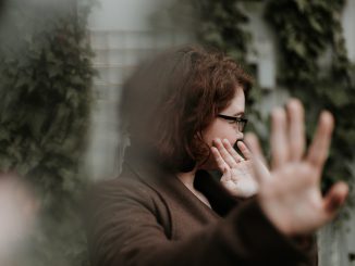 Person throws up their hands and turns away, by Priscilla Du Preez on Unsplash
