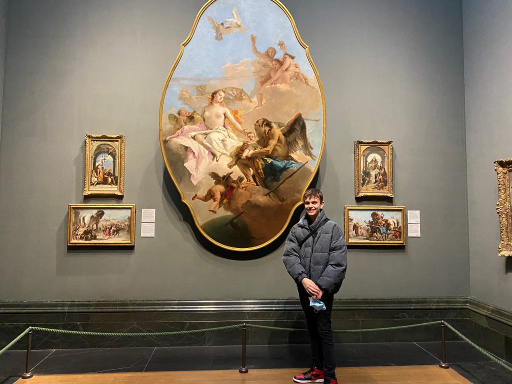 Joseph standing in an art gallery.