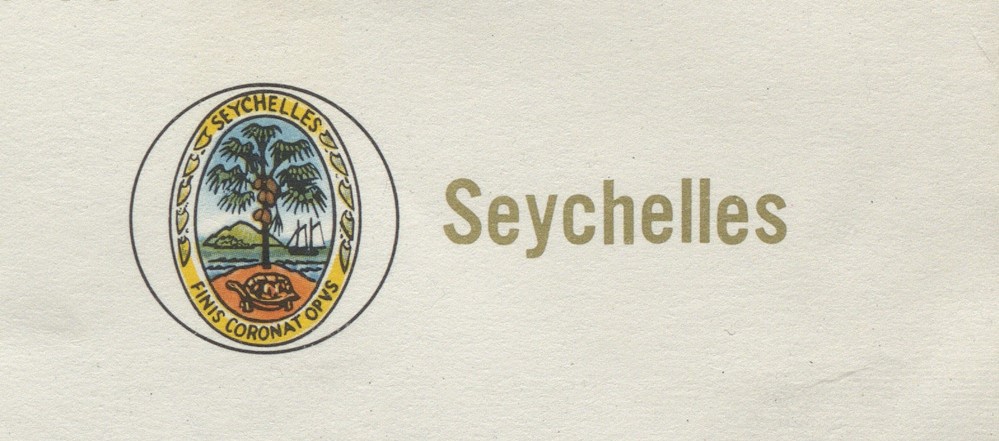 The central badge of Seychelles' flag as of 1961.