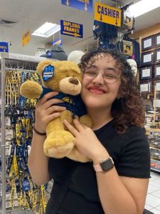 a picture of Sarah, with a Berkeley mascot teddy bear