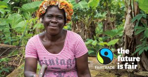 Someone smiling at the camera against a green jungle background and the fairtrade logo with the text "the future is fair"