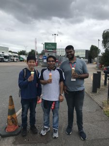 Three students holding icecreams